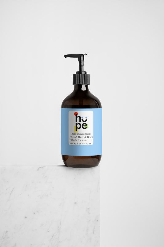 2-in-1 Hair & Body Wash for men, 490 ml / 16.57 fl oz, placed on a marble surface, showcasing the product's design and packaging